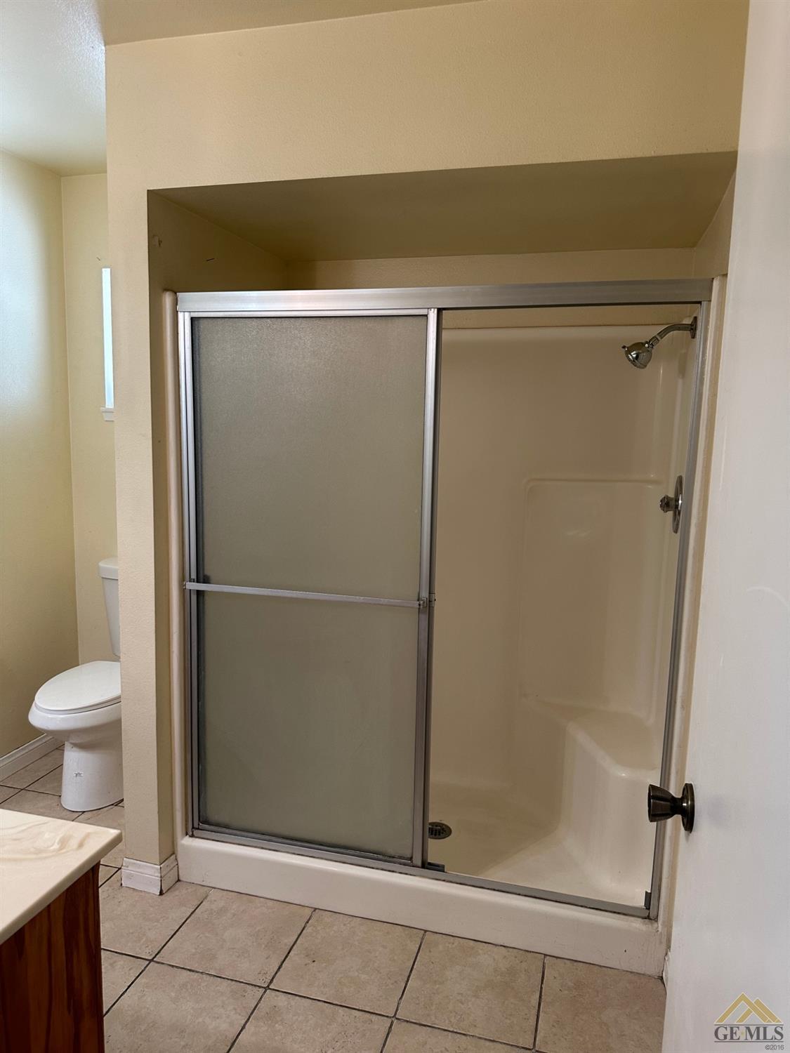 Undisclosed Address Bakersfield, CA 93313 - Photo 9 of 30 a bathroom with a shower