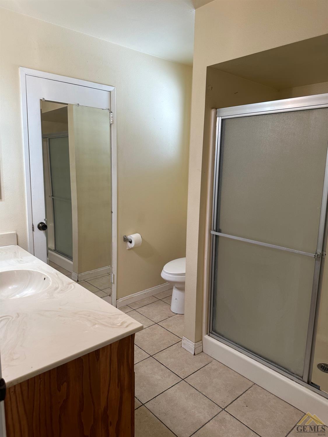 Undisclosed Address Bakersfield, CA 93313 - Photo 10 of 30 a bathroom with a sink a toilet and shower