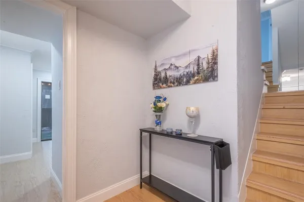a view of a hallway with paintings on the wall