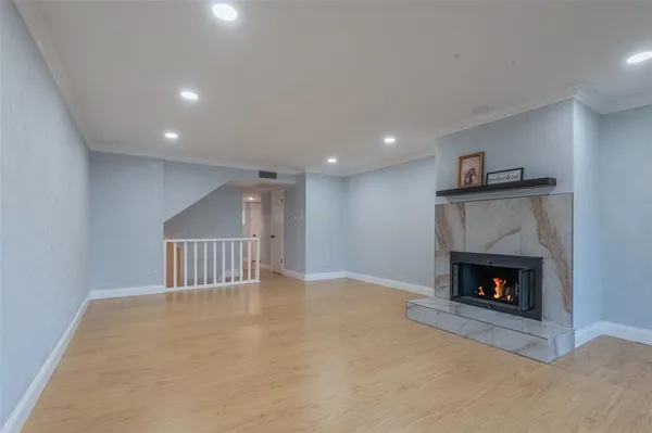 a view of an empty room with a fireplace