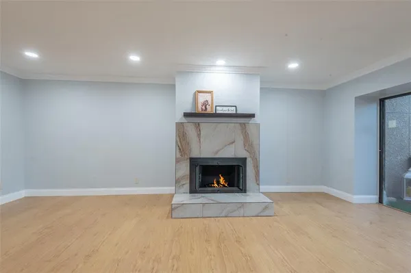 a view of an empty room with a fireplace
