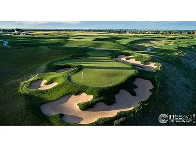 a aerial view of a golf course with a swimming pool