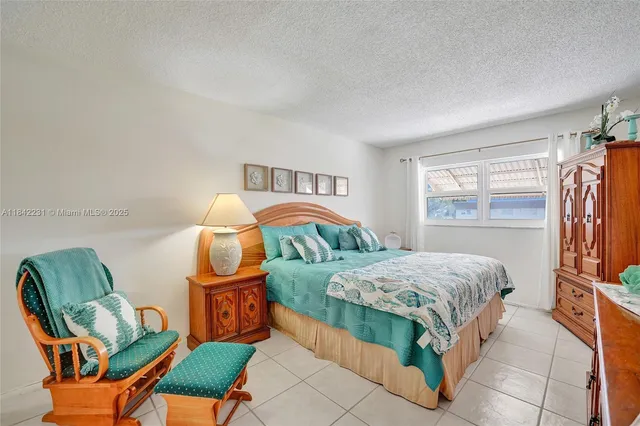 a view of yard from deck with patio