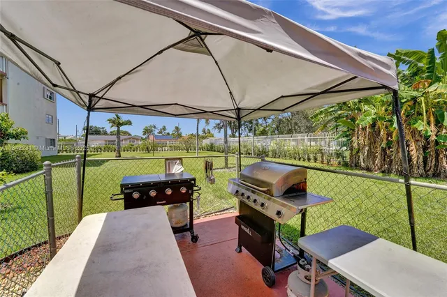 a view of a garden with a building in the background
