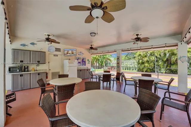 a view of balcony with wooden floor and seating space