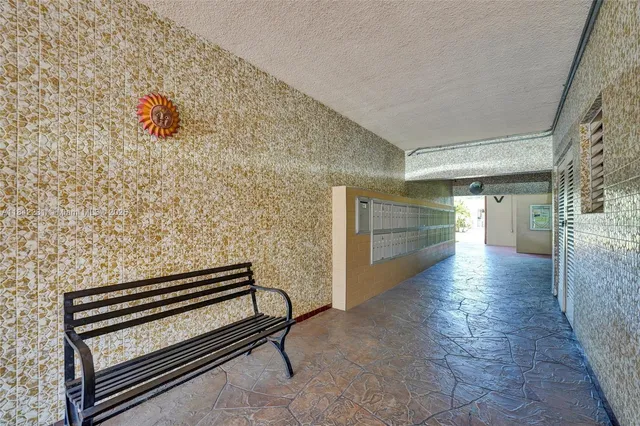 a balcony with furniture and a potted plant