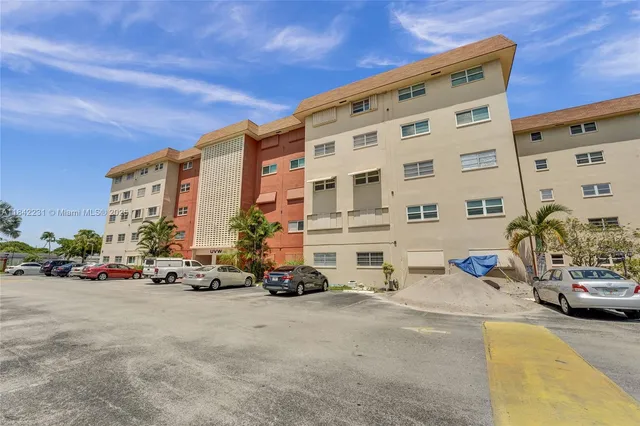 a kitchen with granite countertop a sink cabinets and window