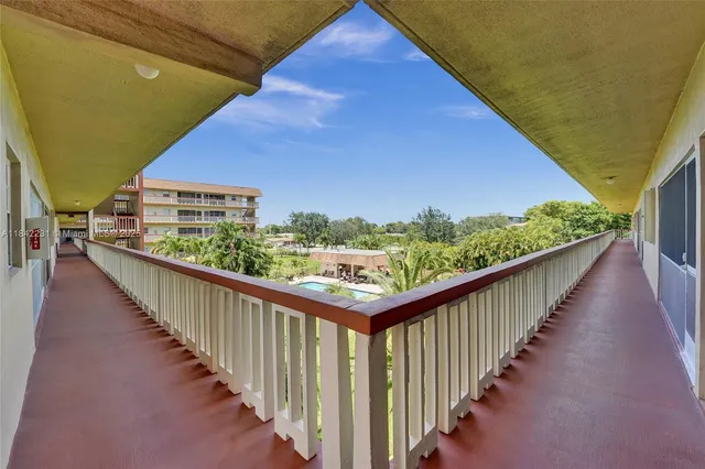 a view of a livingroom with furniture and a bookshelf