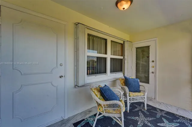 a view of a garden with a building in the background