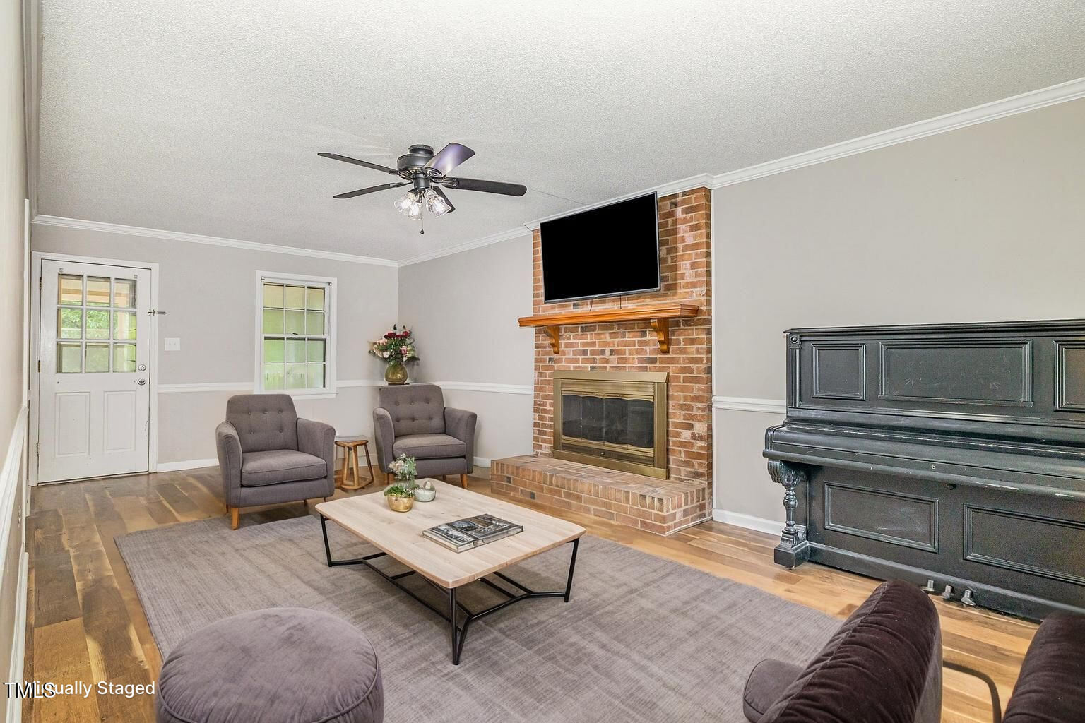 19 Eden Drive Smithfield, NC 27577 - Photo 7 of 37 a living room with furniture fireplace and flat screen tv