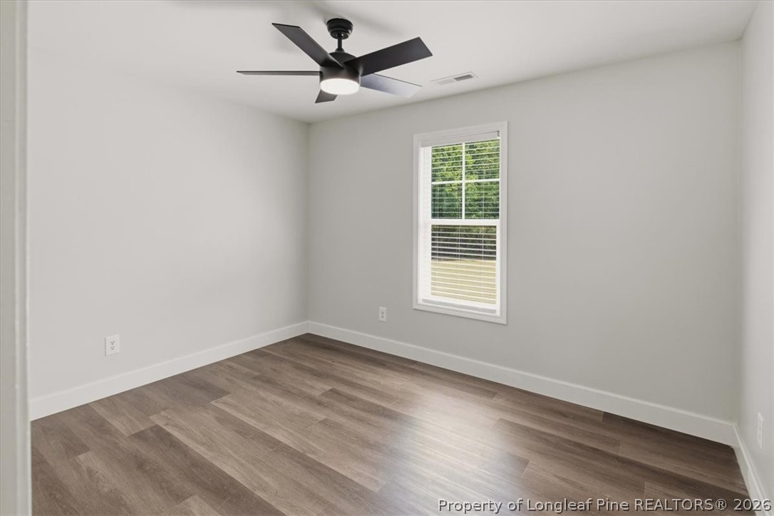 170 Starlight Road Lillington, NC 27546 - Photo 26 of 37 an empty room with a window and a fan