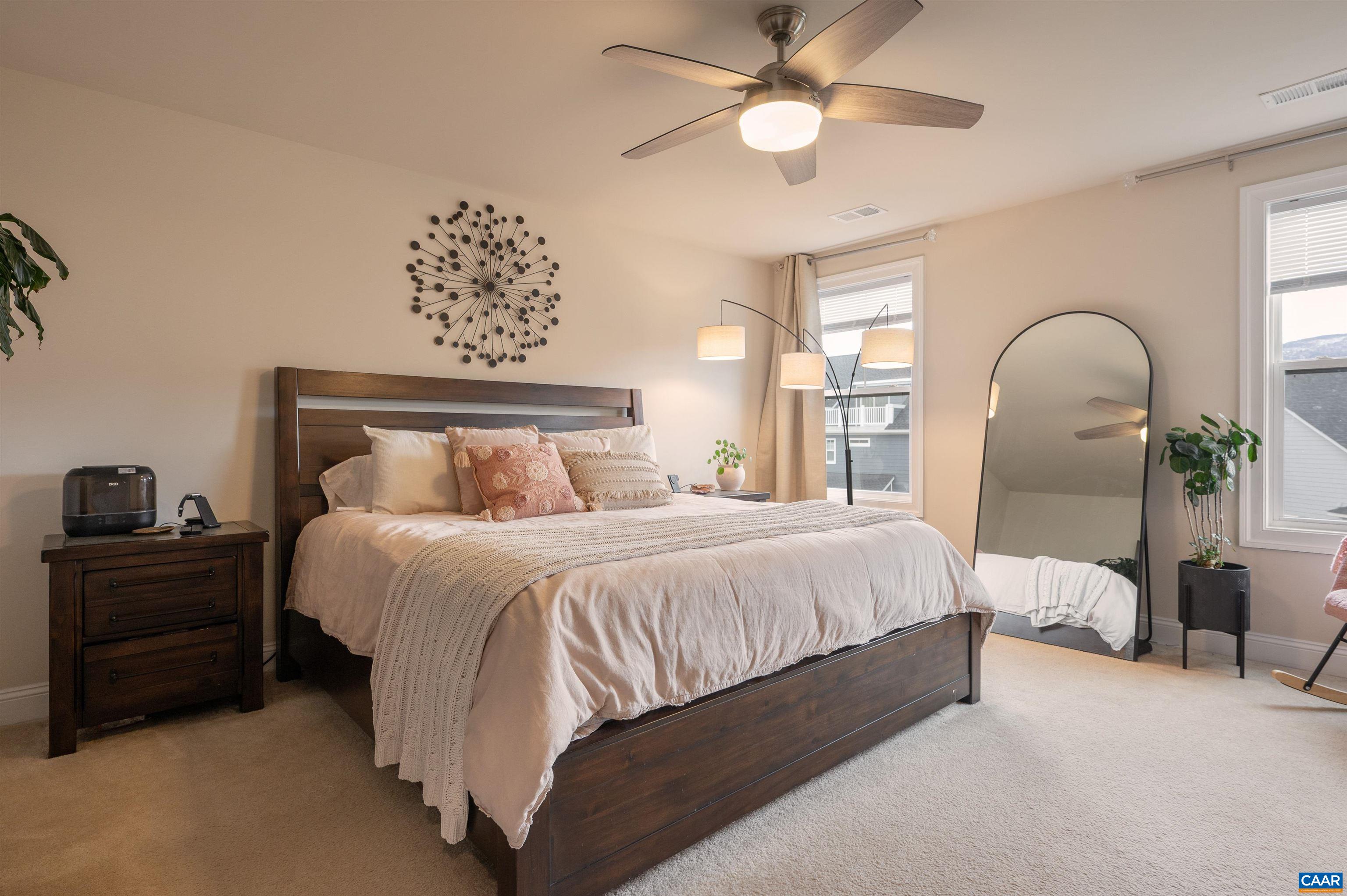 430 Claibourne Road Crozet, VA 22932 - Photo 11 of 25 a bedroom with a bed and a chandelier