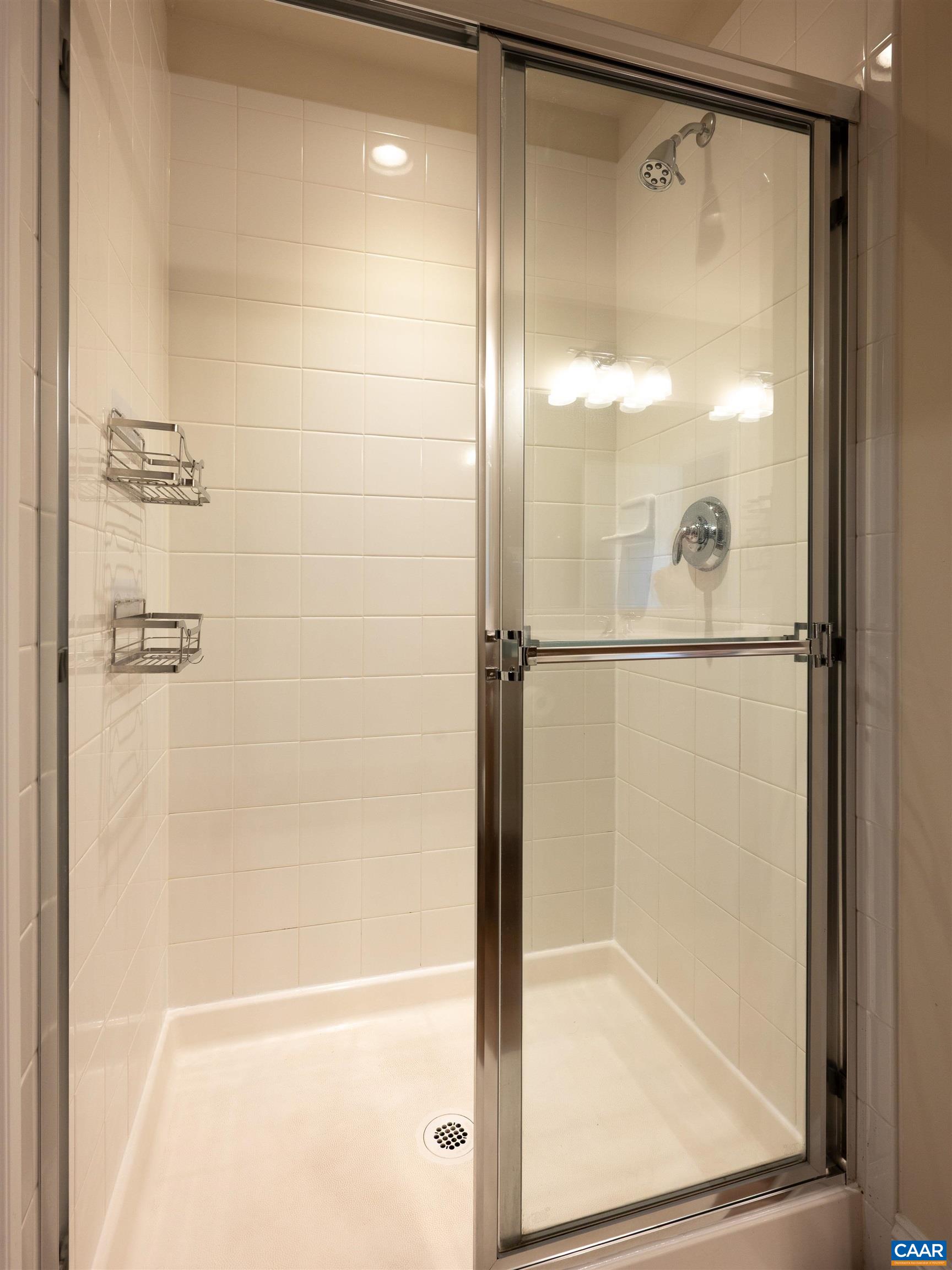 430 Claibourne Road Crozet, VA 22932 - Photo 13 of 25 a bathroom with a glass shower door
