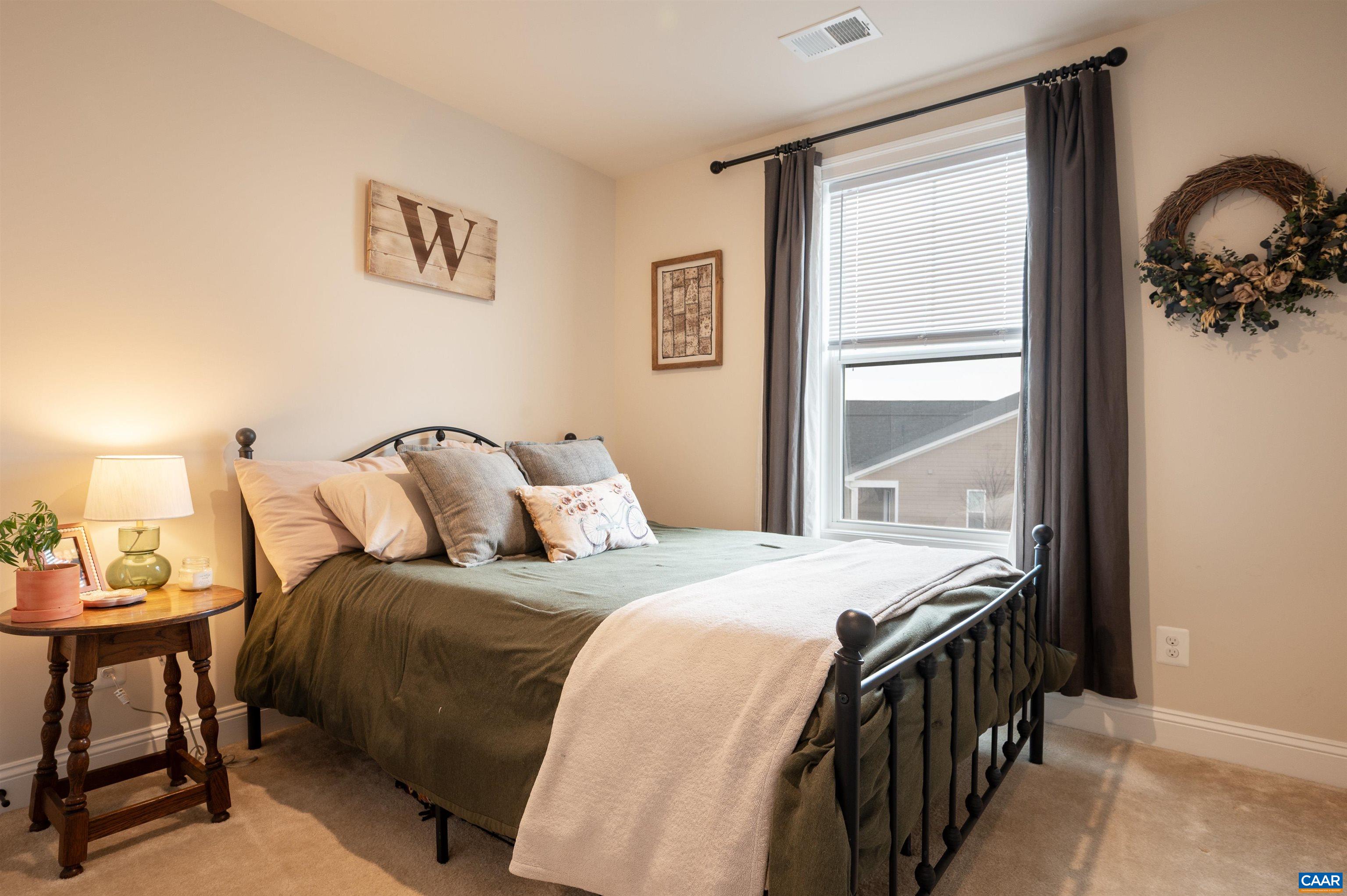 430 Claibourne Road Crozet, VA 22932 - Photo 16 of 25 a bedroom with a bed and a window