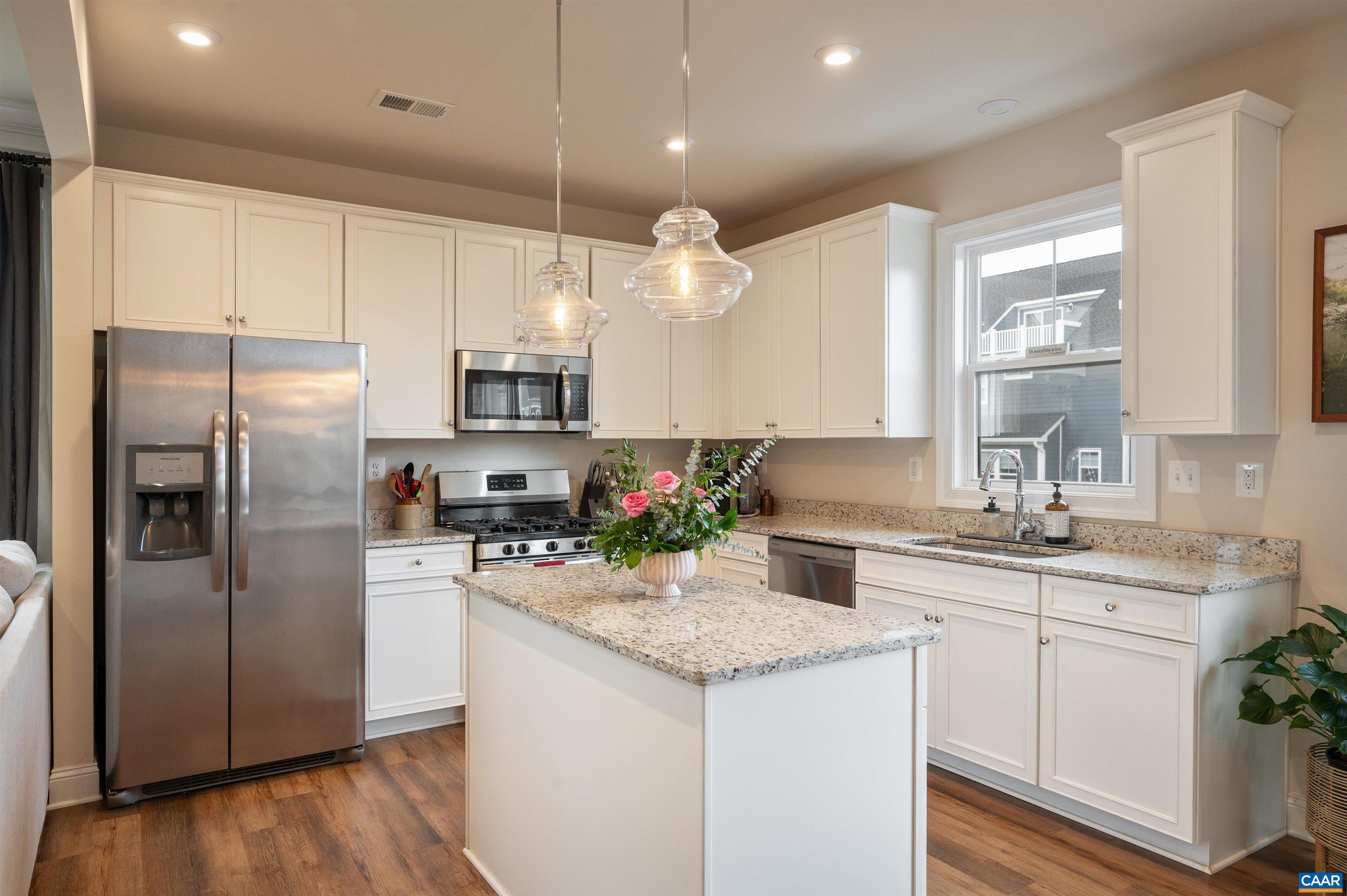 430 Claibourne Road Crozet, VA 22932 - Photo 7 of 25 a kitchen with a sink stainless steel appliances a sink and cabinets