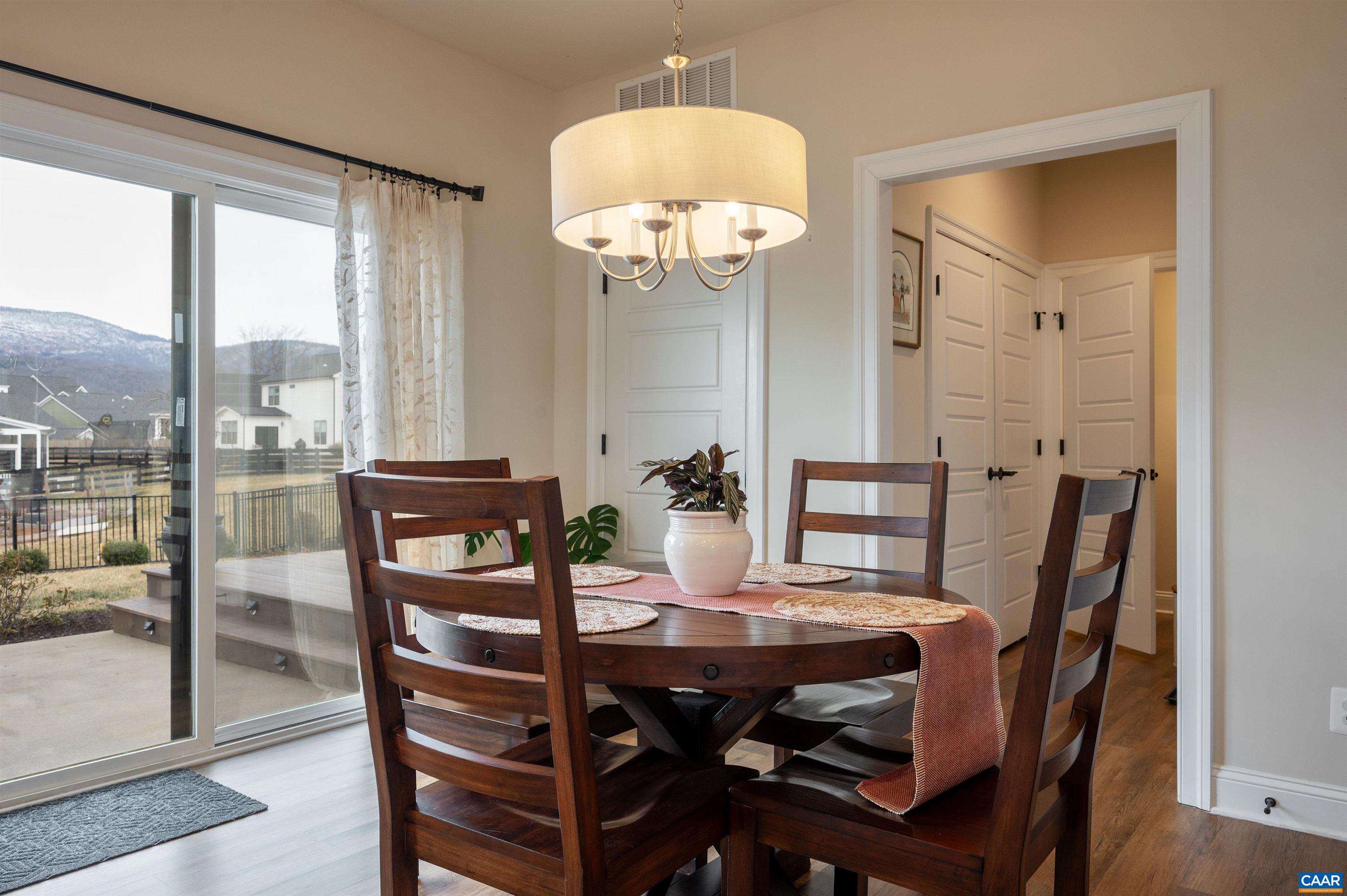 430 Claibourne Road Crozet, VA 22932 - Photo 8 of 25 a view of a dining room with furniture window and wooden floor