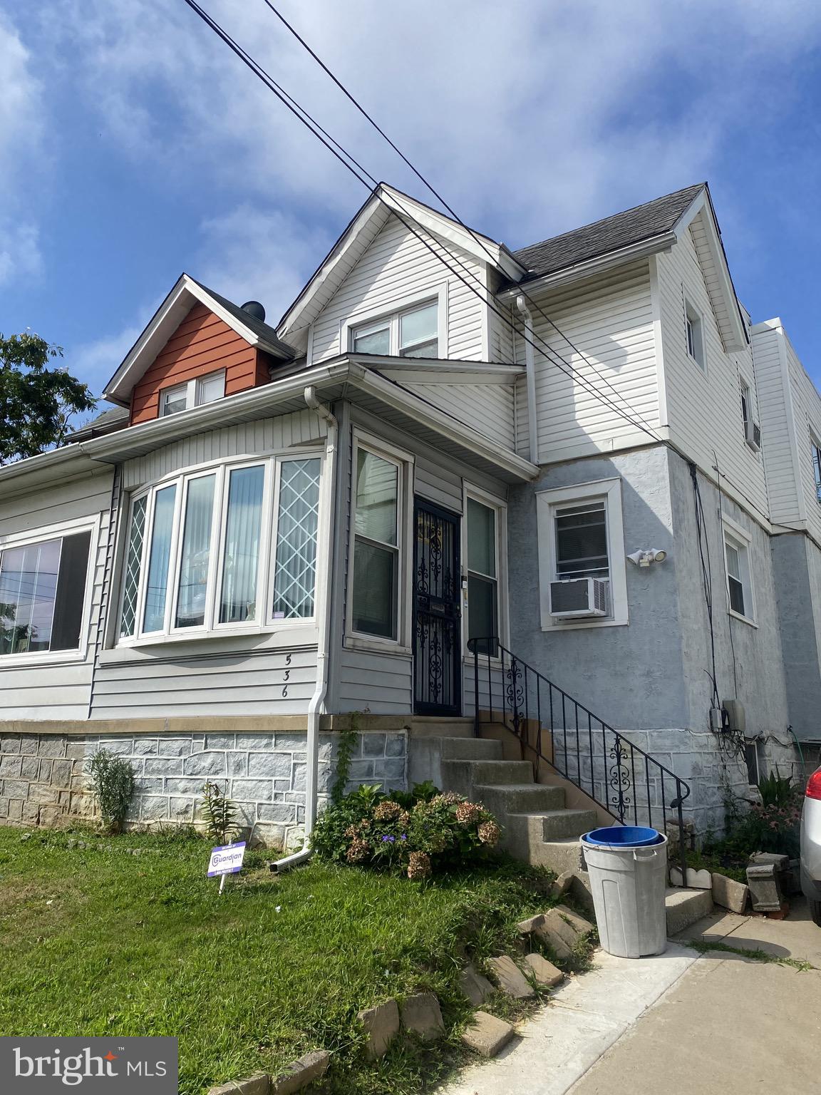 536 Cypress Street Lansdowne, PA 19050 - Photo 19 of 22 a front view of a house with a yard and potted plants