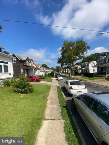 a view of multiple houses with a yard