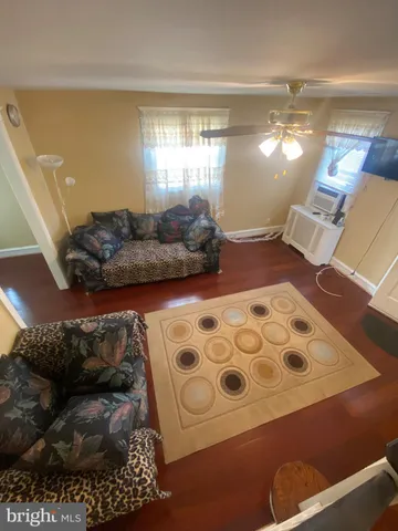 a living room with furniture and a rug
