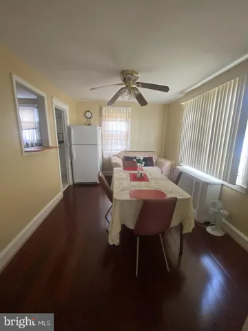 a view of a dining room with furniture and window