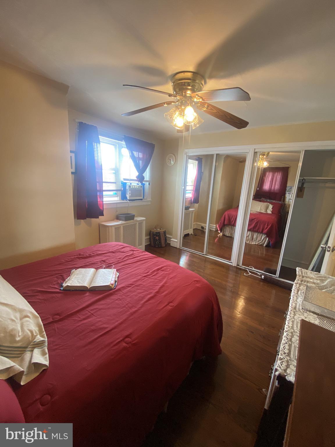 536 Cypress Street Lansdowne, PA 19050 - Photo 10 of 22 a bed room with a bed and a mirror