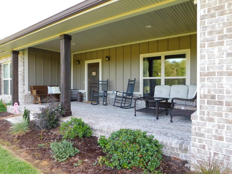 5856 Bush Road Baker, FL 32531 - Photo 4 of 57 a view of a house with backyard porch and sitting area