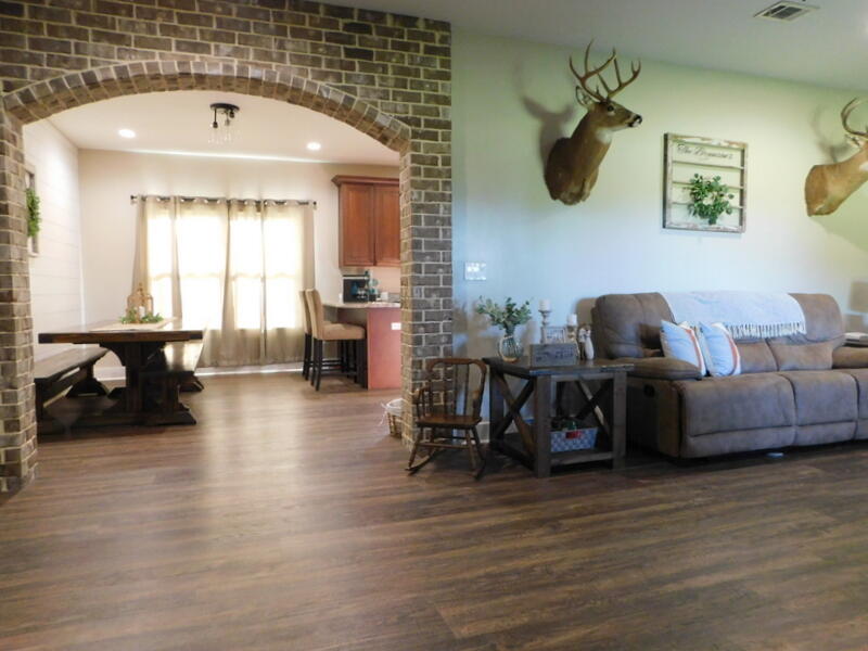 5856 Bush Road Baker, FL 32531 - Photo 9 of 57 a living room with furniture and wooden floor