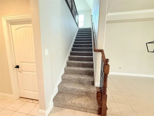 a bathroom with a sink mirror and a toilet