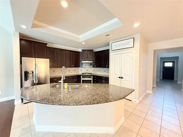 a living room with furniture flat screen tv and a fireplace