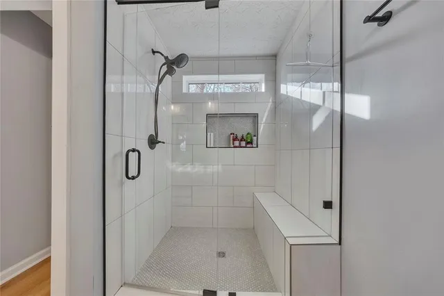 a view of a livingroom with workspace and a window