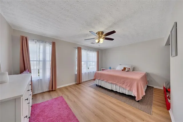 a bedroom with a bed and a walk in closet