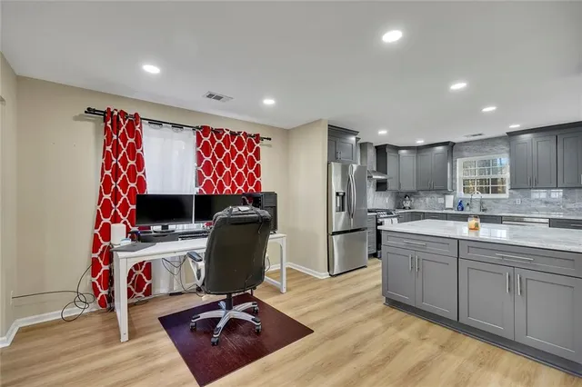 a workspace with furniture and wooden floor