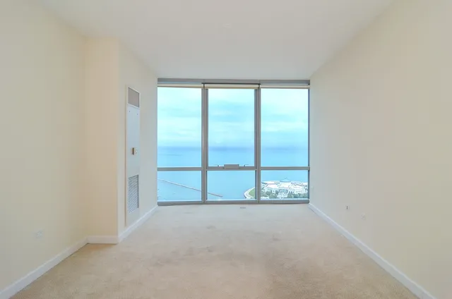 an empty room with large window