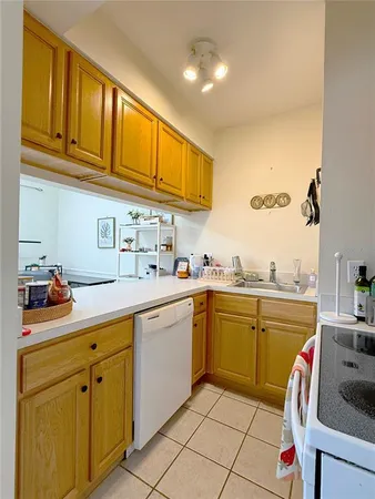 a bedroom with a bed and a chair