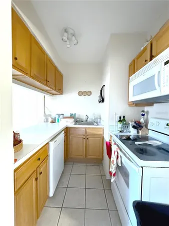 a bathroom with a sink a toilet a mirror and vanity