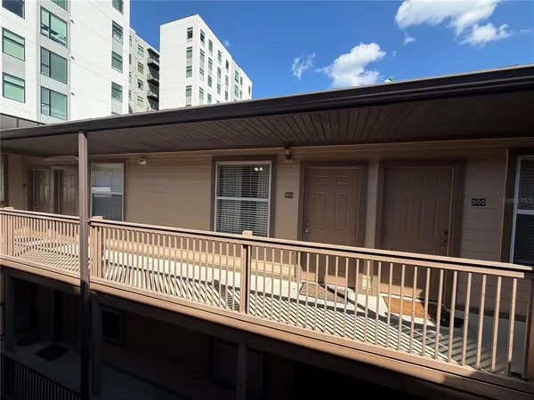 a view of a park with potted plants
