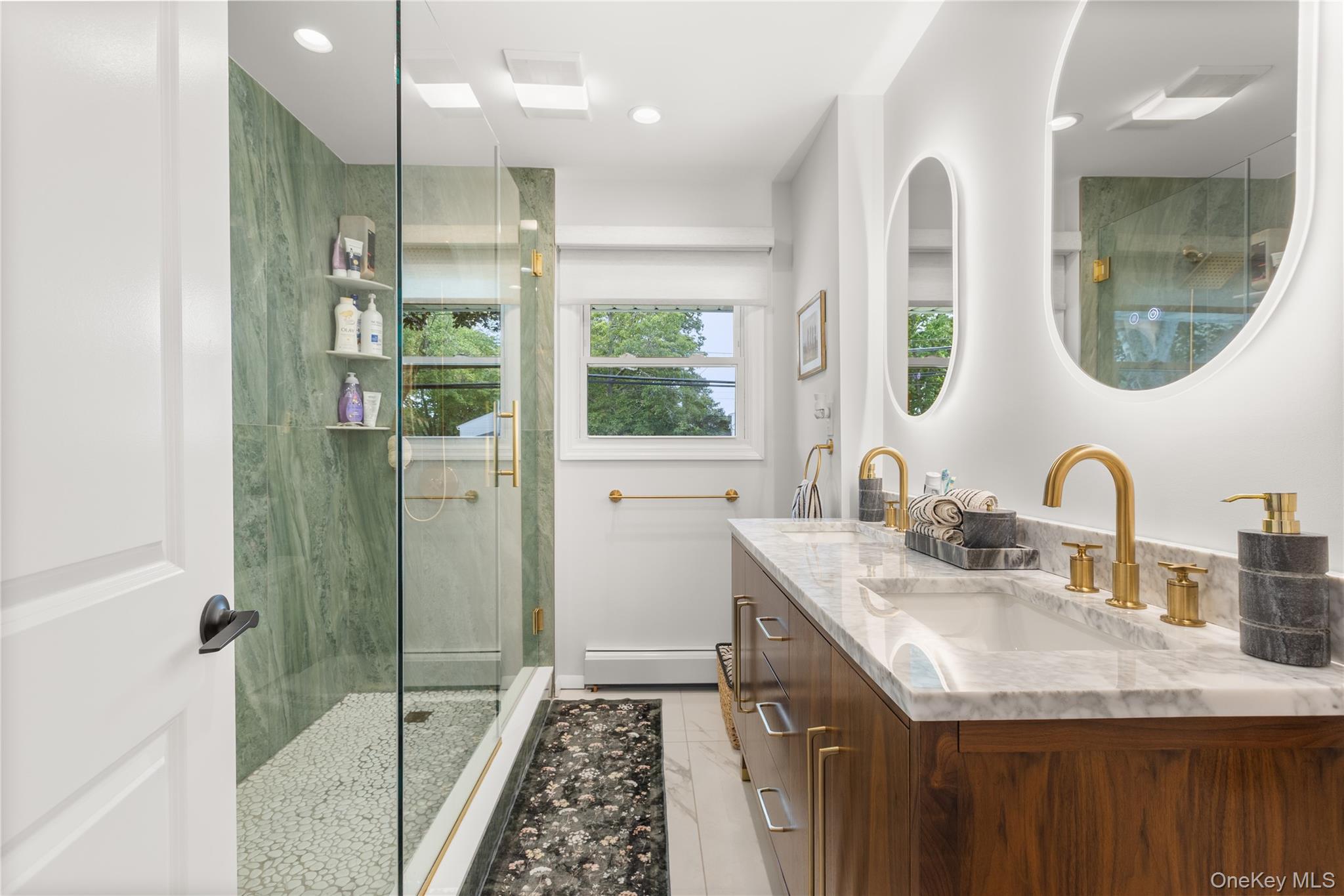 205 Timber Point Road East Islip, NY 11730 - Photo 10 of 16 Bathroom featuring a stall shower, double vanity, a baseboard radiator, and recessed lighting