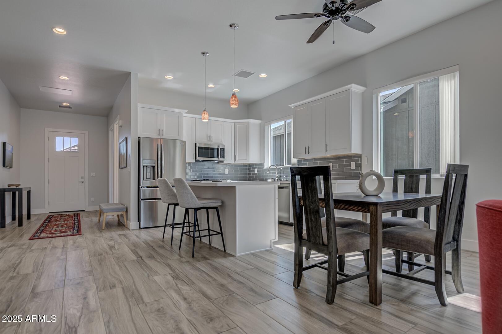2007 East Rainbow Trail Payson, AZ 85541 - Photo 13 of 34 a open kitchen with stainless steel appliances refrigerator dining table and chairs