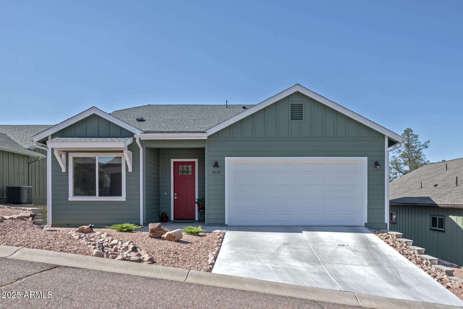 2007 East Rainbow Trail Payson, AZ 85541 - Photo 2 of 34 a front view of a house with a garage