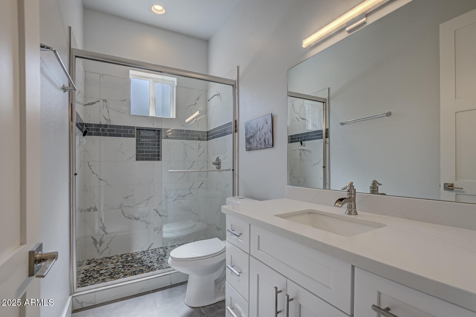 2007 East Rainbow Trail Payson, AZ 85541 - Photo 26 of 34 a bathroom with a sink toilet a mirror and shower