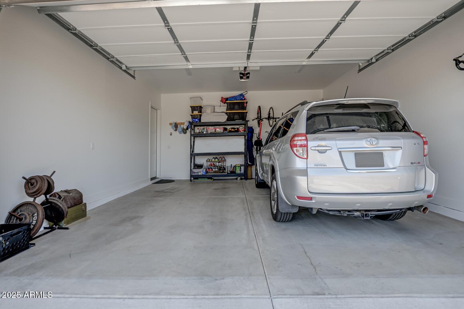 2007 East Rainbow Trail Payson, AZ 85541 - Photo 8 of 34 a car and bike parked in a garage