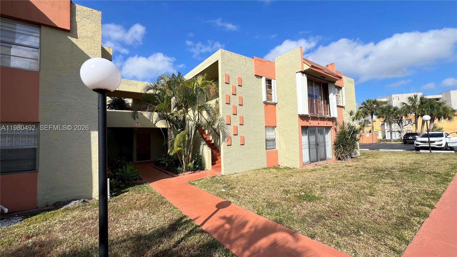a view of a house with backyard of the house