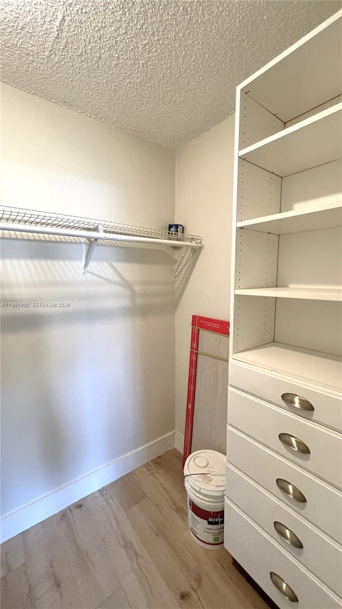 9331 Southwest 4th Street, Unit 101A Miami, FL 33174 - Photo 12 of 15 a bathroom with a toilet a sink and a mirror