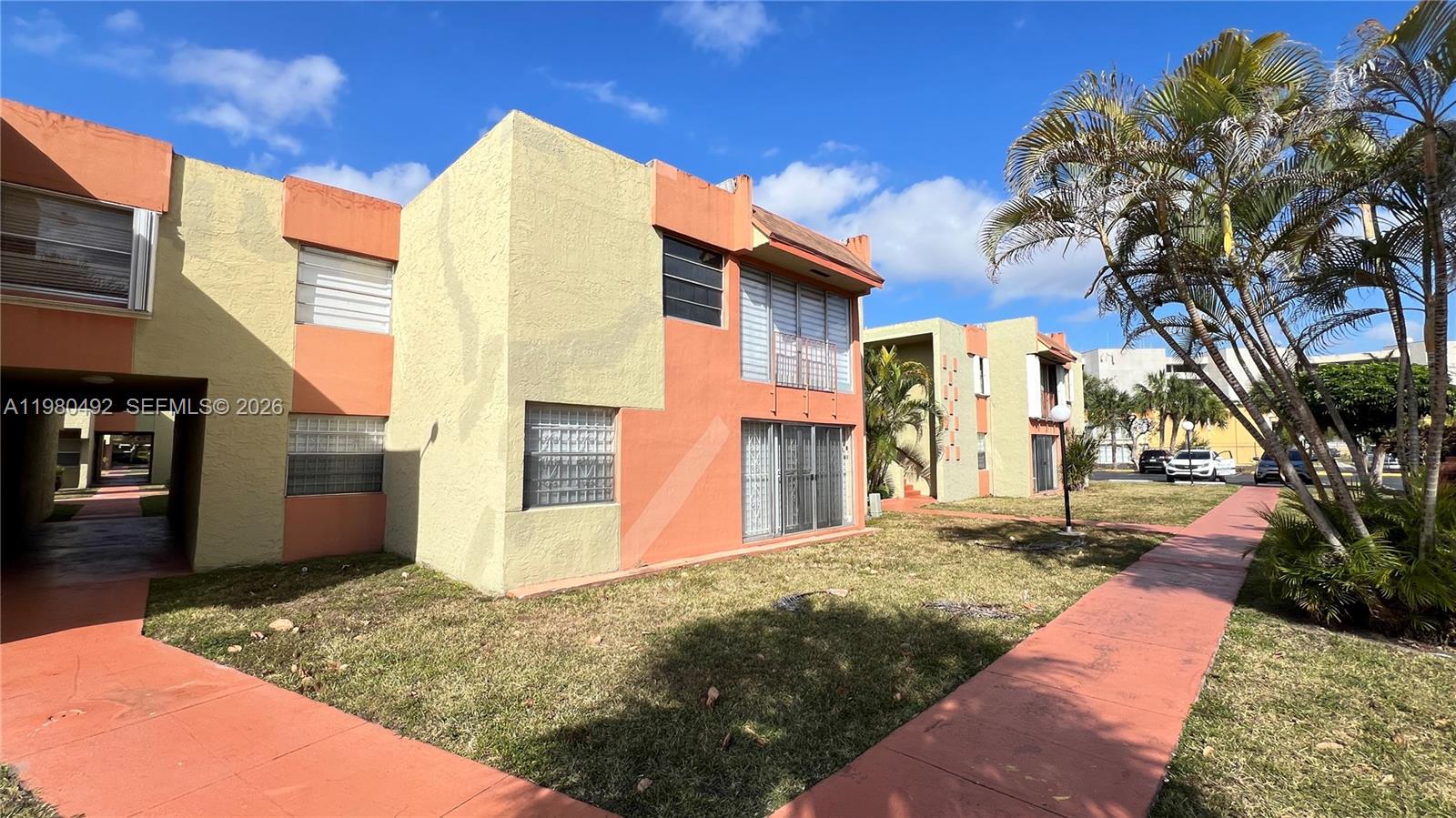 9331 Southwest 4th Street, Unit 101A Miami, FL 33174 - Photo 15 of 15 a view of a house with a yard