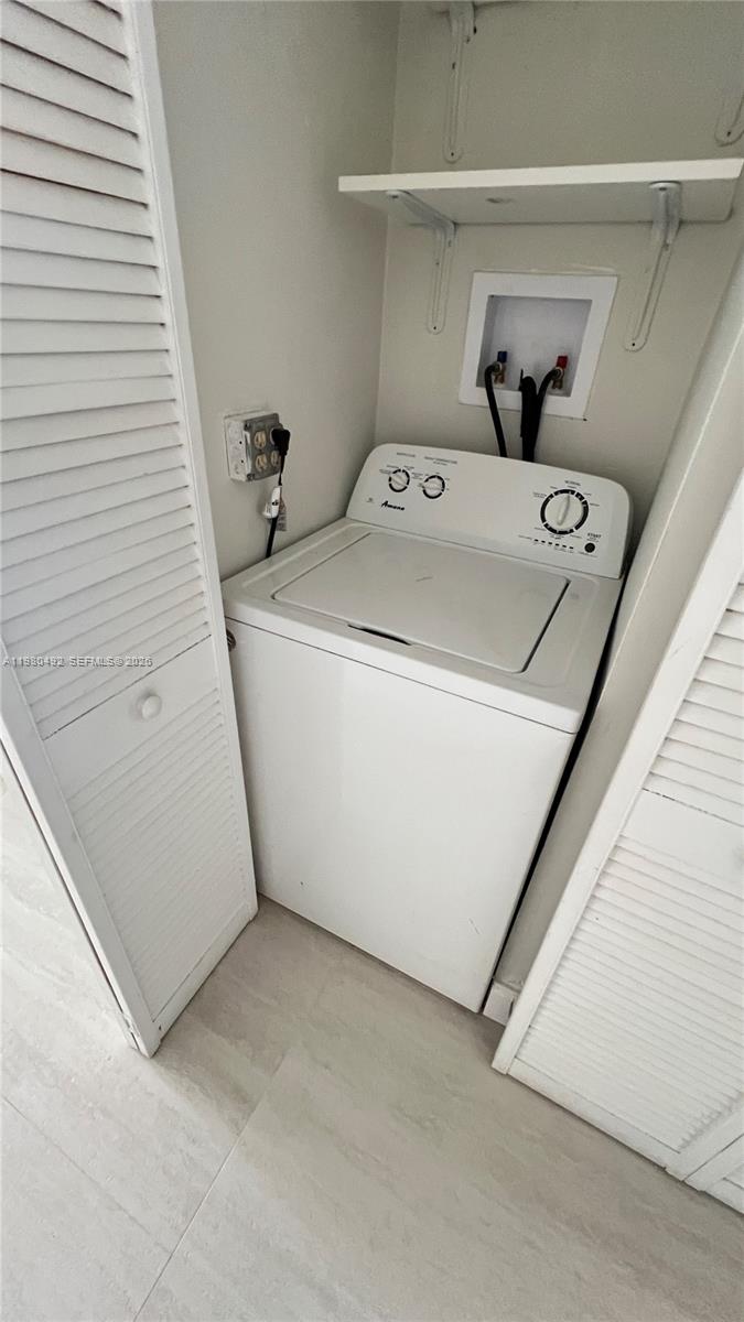 9331 Southwest 4th Street, Unit 101A Miami, FL 33174 - Photo 9 of 15 a utility room with dryer and washer