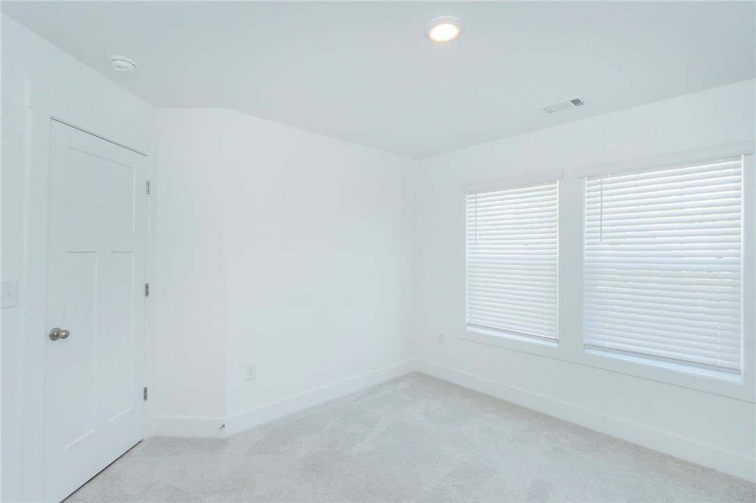 607 WH Kay Lane Anderson, SC 29621 - Photo 31 of 48 A well-lit, quiet room features soft carpeting and generous window light, perfect for relaxation.