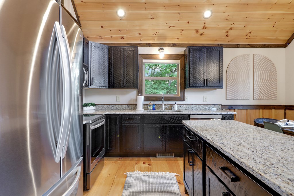 42 Old Jerusalem Road Morganton, GA 30560 - Photo 12 of 61 a kitchen with stainless steel appliances granite countertop a sink stove and refrigerator