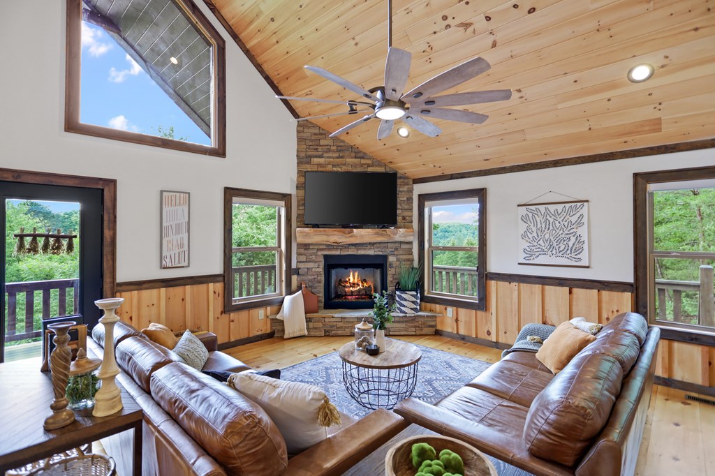 42 Old Jerusalem Road Morganton, GA 30560 - Photo 14 of 61 a living room with furniture a fireplace and a large window