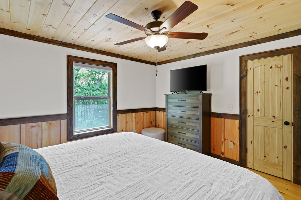 42 Old Jerusalem Road Morganton, GA 30560 - Photo 20 of 61 a bedroom with a bed and a flat screen tv