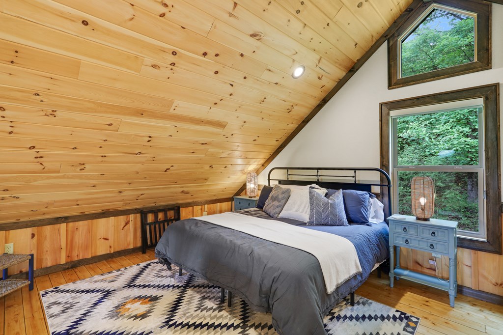 42 Old Jerusalem Road Morganton, GA 30560 - Photo 30 of 61 a bedroom with a bed and wooden floor